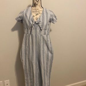 The back zips up, boat aesthetic, blue, striped, young lady